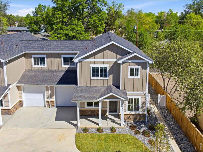 Front exterior of a new home in , Loveland, CO, highlighting curb appeal (Image 22).