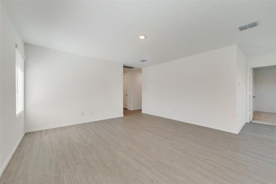 Unfurnished room with light hardwood / wood-style floors