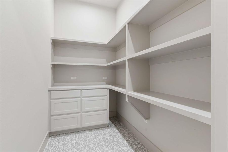 Huge walk in kitchen pantry with built in storage drawers and shelving. Huge walk in kitchen pantry with built in storage drawers and shelving.
