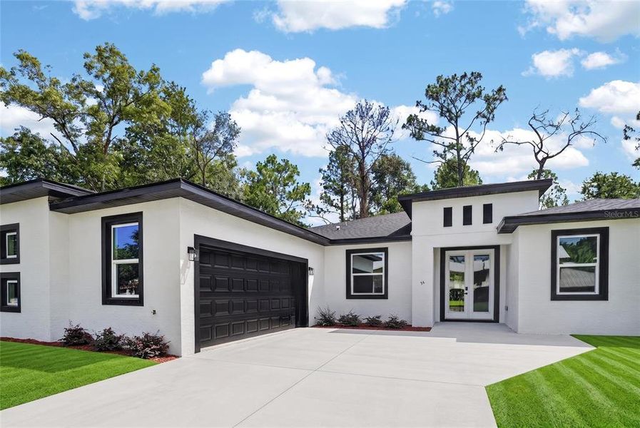 Front exterior of a new home in , Homosassa, FL, highlighting curb appeal (Image 2). Front exterior of a new home in , Homosassa, FL, highlighting curb appeal (Image 2).