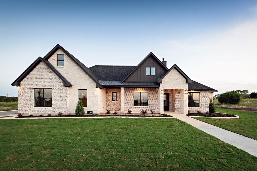 Front exterior of a new home in , Salado, TX, highlighting curb appeal (Image 23). Front exterior of a new home in , Salado, TX, highlighting curb appeal (Image 23).
