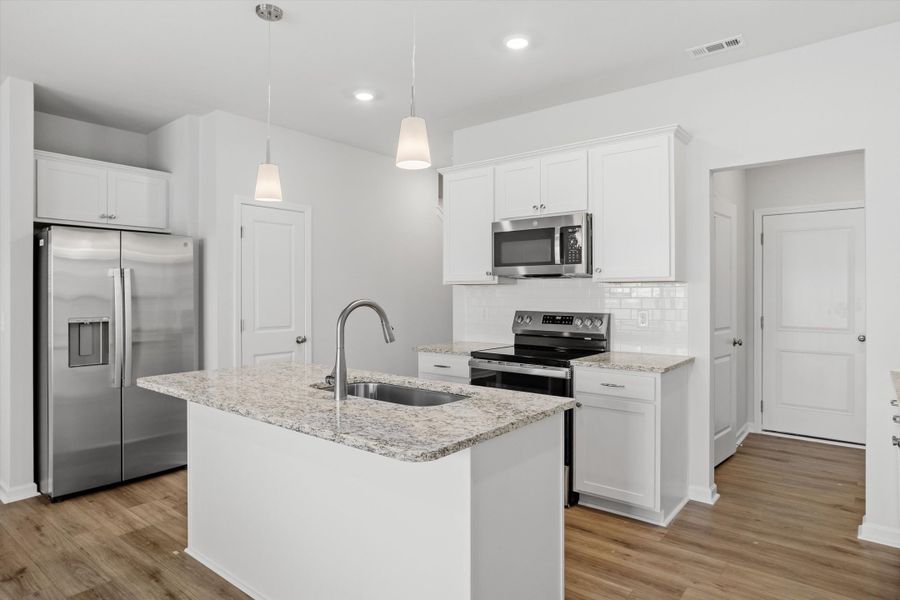 Furnished interior view inside a new home in West Main Townhomes, Sanford (Image 6).