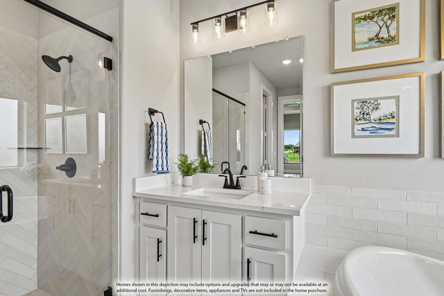 Bathroom with white vanity, quartz countertop, glass shower, and subway tile walls Bathroom with white vanity, quartz countertop, glass shower, and subway tile walls