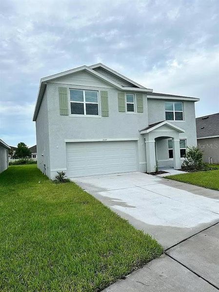 Front exterior of a new home in , Wimauma, FL, highlighting curb appeal (Image 2).