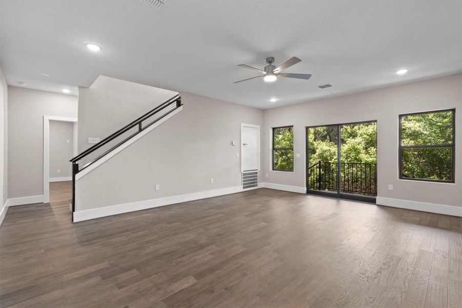 A spacious, airy living area offers wide plank hardwood floors and generous natural illumination. A spacious, airy living area offers wide plank hardwood floors and generous natural illumination.