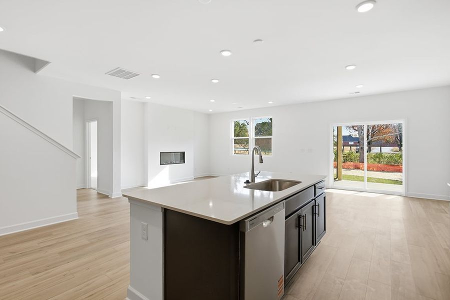 A kitchen with a large island. A kitchen with a large island.