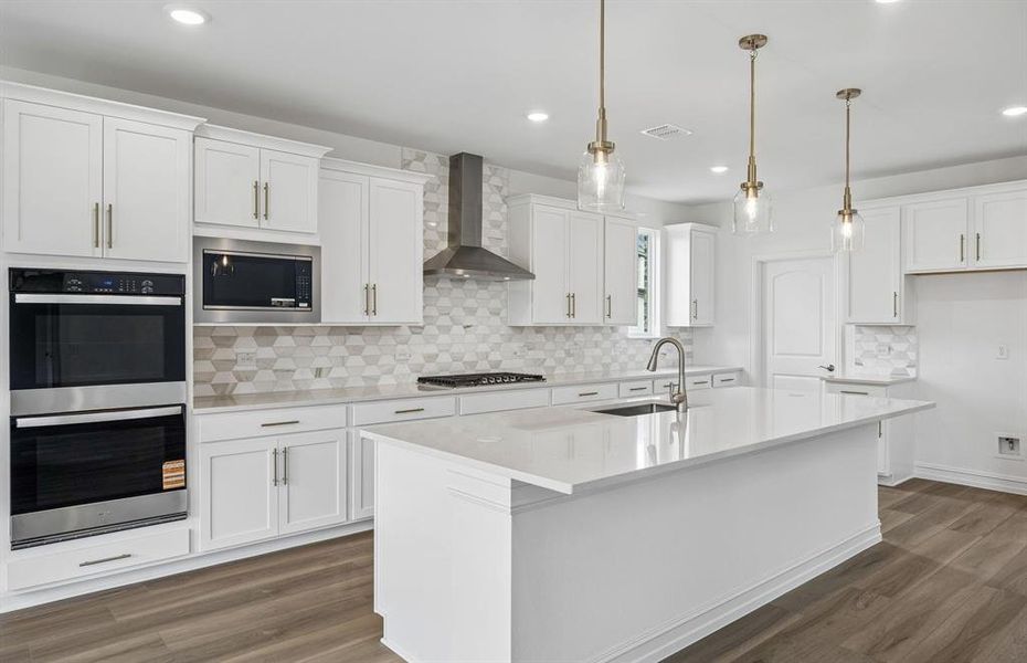 Beautiful kitchen with pendent lighting