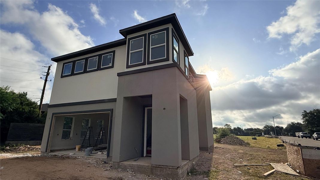 A newly constructed modern home awaits its finishing touches, promising contemporary living.