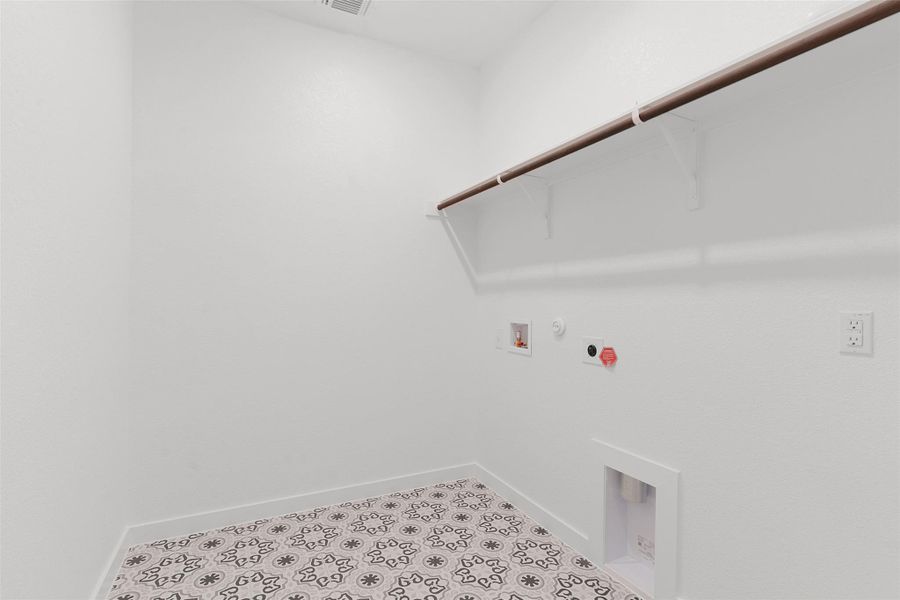 Laundry area featuring hookup for a gas dryer, washer hookup, and tile patterned floors