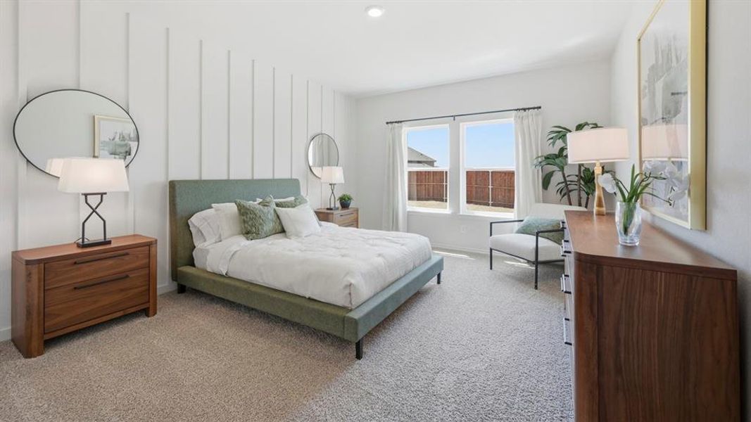 Bedroom with carpet flooring and baseboards Bedroom with carpet flooring and baseboards