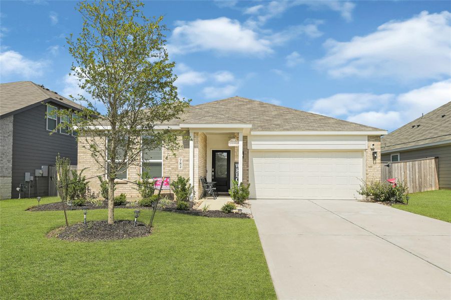 Charming single-story home with a welcoming front porch, manicured lawn, and a spacious two-car garage. Charming single-story home with a welcoming front porch, manicured lawn, and a spacious two-car garage.
