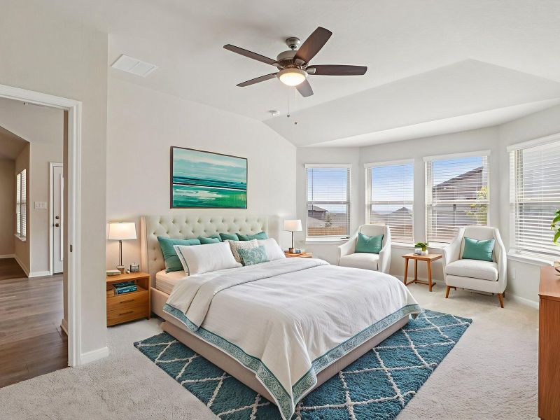 Virtually staged primary suite in the Callaghan floorplan at a Meritage Homes community.