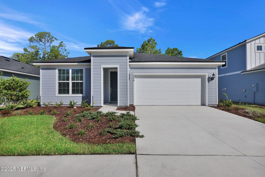 Front exterior of a new home in Bradley Creek, Green Cove Springs, FL, highlighting curb appeal (Image 2).