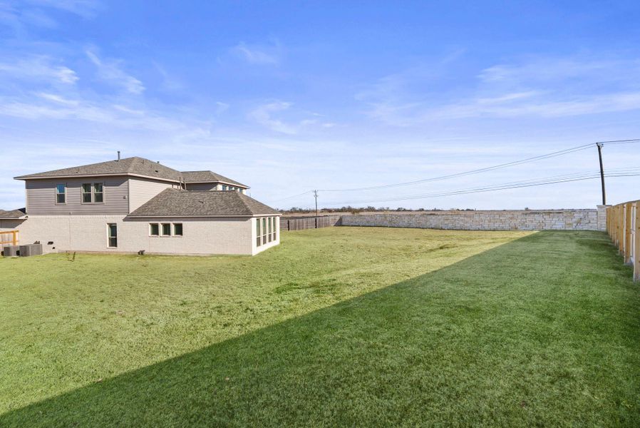 View of fenced backyard