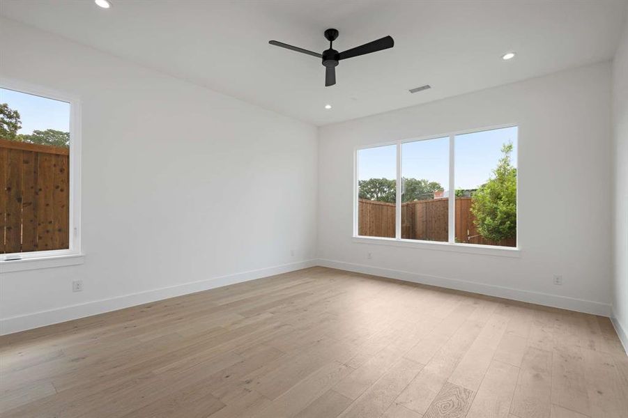 Spare room featuring light hardwood / wood-style floors and ceiling fan