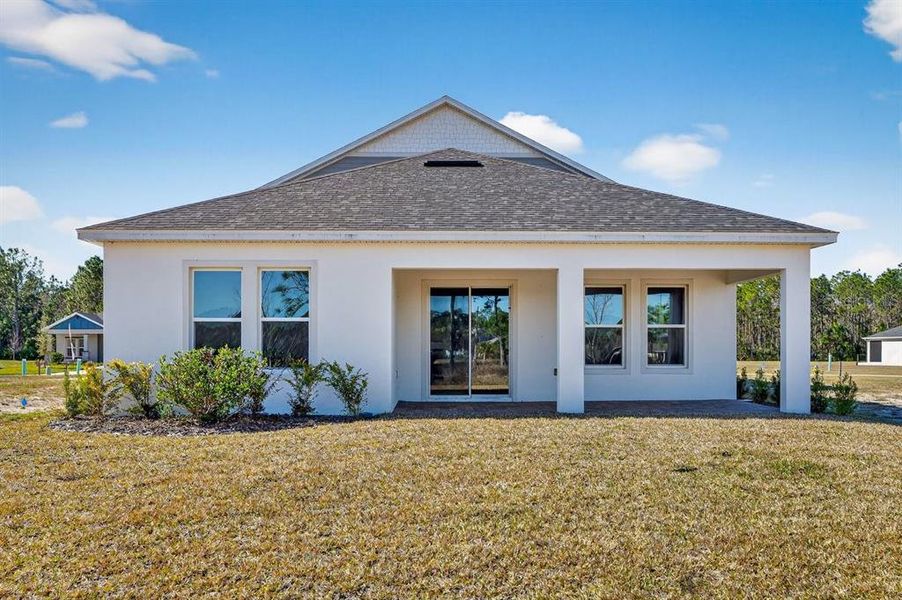Exterior details and patio area of a home in Gray Hawk at Hole Two, Daytona Beach (Image 33).