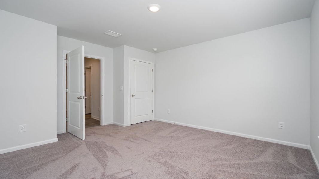 Representative unfurnished interior of a home built from the Cali by D.R. Horton in Jordanville Farms, Galivants Ferry (Image 23).