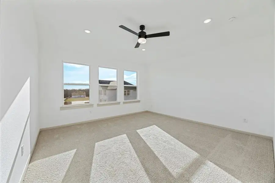 High ceilings, plush carpeting, a wall of windows and luxurious en suite bath create an owner's suite that you will never want to leave!