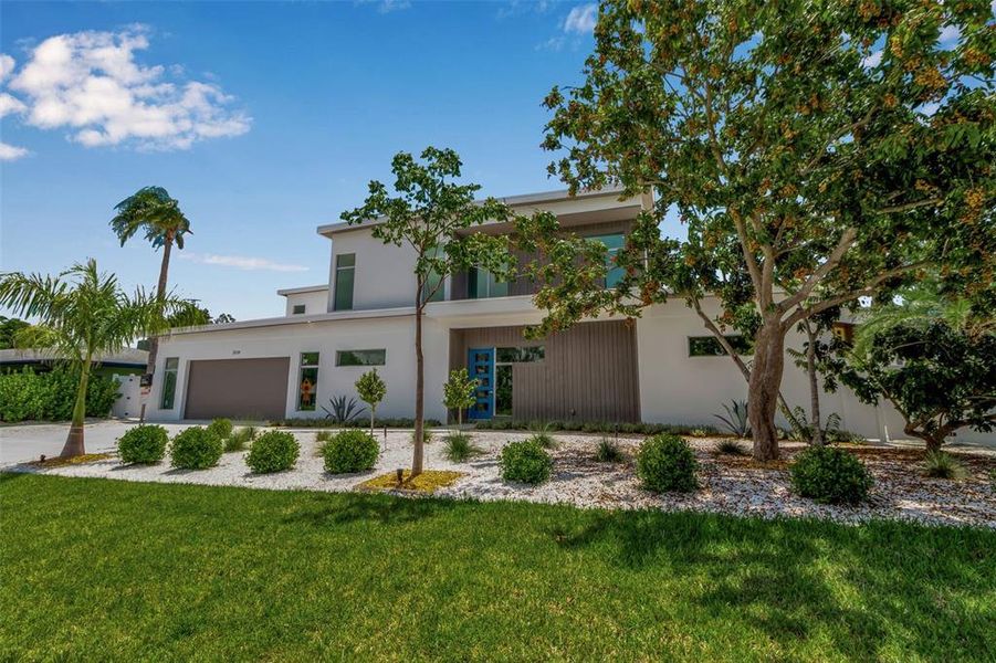 Front exterior of a new home in , Sarasota, FL, highlighting curb appeal (Image 22).