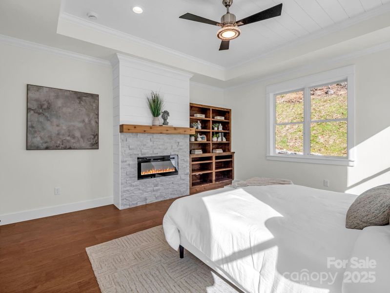 Primary has a second gas fireplace and built-ins!