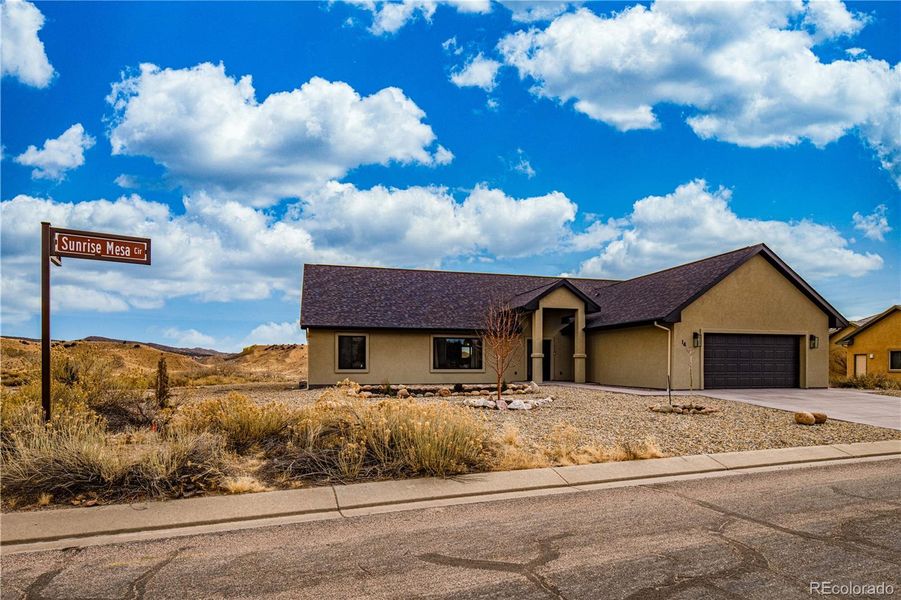 Front exterior of a new home in , Cañon City, CO, highlighting curb appeal (Image 26). Front exterior of a new home in , Cañon City, CO, highlighting curb appeal (Image 26).