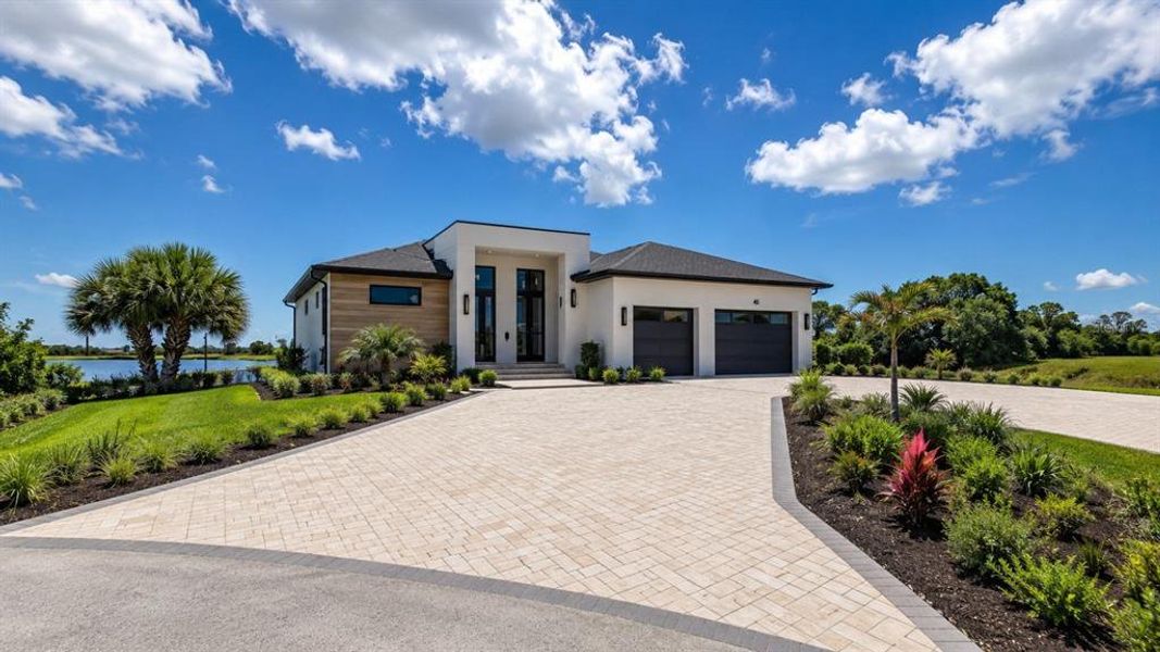 Front exterior of a new home in , Placida, FL, highlighting curb appeal (Image 2). Front exterior of a new home in , Placida, FL, highlighting curb appeal (Image 2).