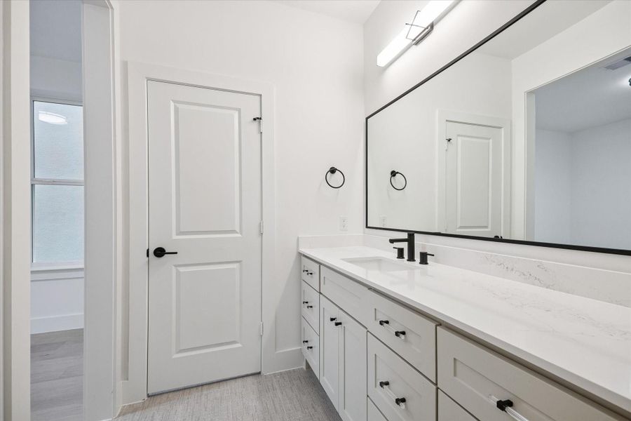 secondary bathroom featuring a clean, functional layout designed for comfort and everyday convenience.