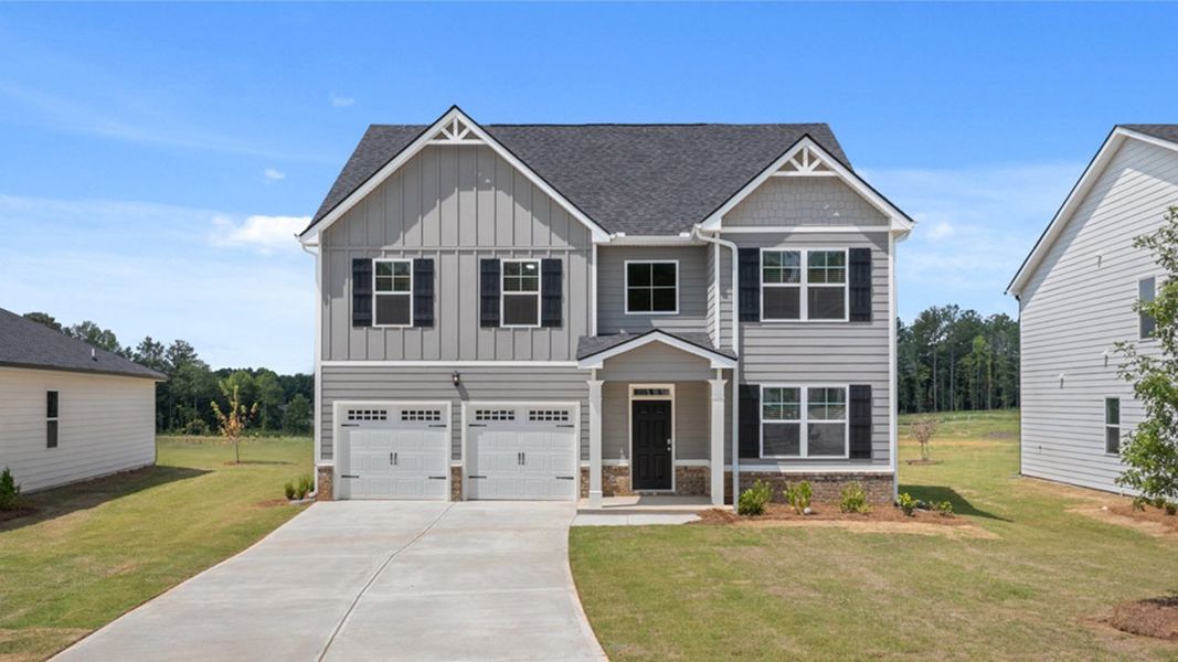 Front exterior of a new home in Oakchase at Hampton, Hampton, GA, highlighting curb appeal (Image 1).