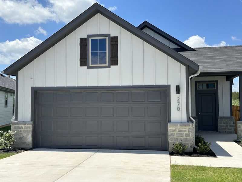 Front exterior of a new home in Trinity Ranch, Elgin, TX, highlighting curb appeal (Image 18). Front exterior of a new home in Trinity Ranch, Elgin, TX, highlighting curb appeal (Image 18).