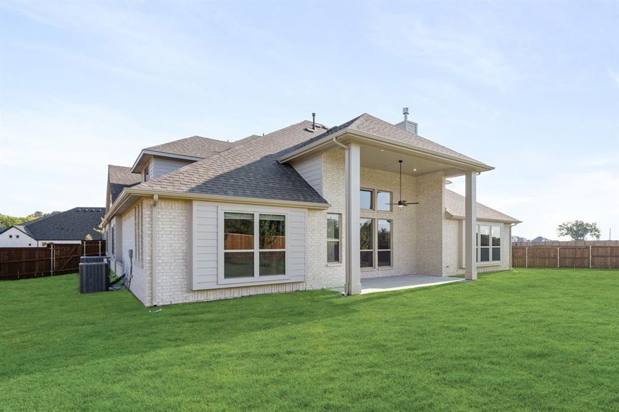 Front exterior of a new home in Rockwood 90, Mansfield, TX, highlighting curb appeal (Image 1). Front exterior of a new home in Rockwood 90, Mansfield, TX, highlighting curb appeal (Image 1).