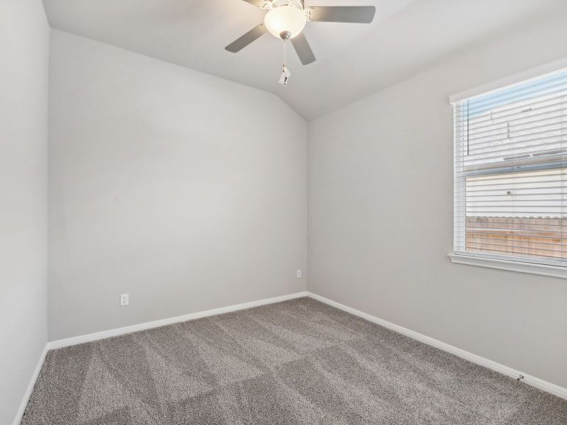 Two of the secondary bedrooms share a bathroom with dual sinks.