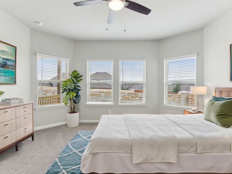 Virtually staged primary suite in the Matador floorplan at a Meritage Homes community.