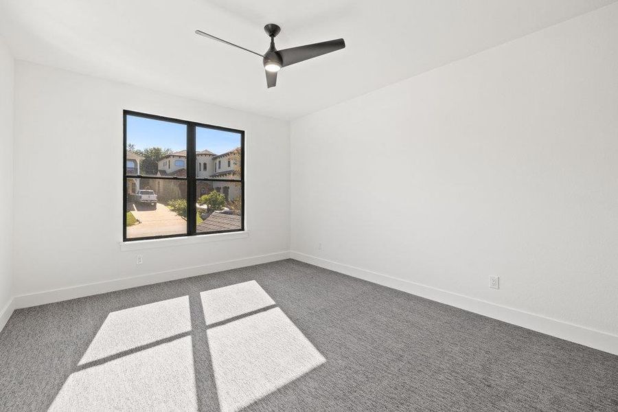 The other secondary bedroom upstairs that is connected to the jack-n-jill bath, also with a custom walk-in closet.