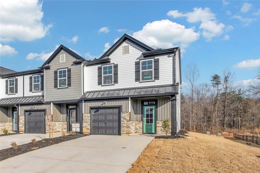 Front exterior of a new home in Meece Townhomes, Easley, SC, highlighting curb appeal (Image 2). Front exterior of a new home in Meece Townhomes, Easley, SC, highlighting curb appeal (Image 2).