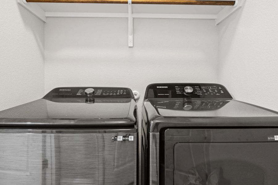 Laundry room with washing machine and dryer and laundry area Laundry room with washing machine and dryer and laundry area