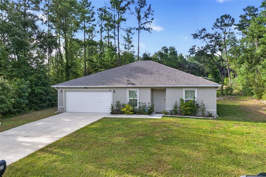 Front exterior of a new home in Ocala, Ocala, FL, highlighting curb appeal (Image 2). Front exterior of a new home in Ocala, Ocala, FL, highlighting curb appeal (Image 2).