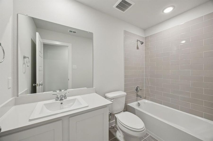 Bathroom in the Hadley home plan by Trophy Signature Homes – REPRESENTATIVE PHOTO