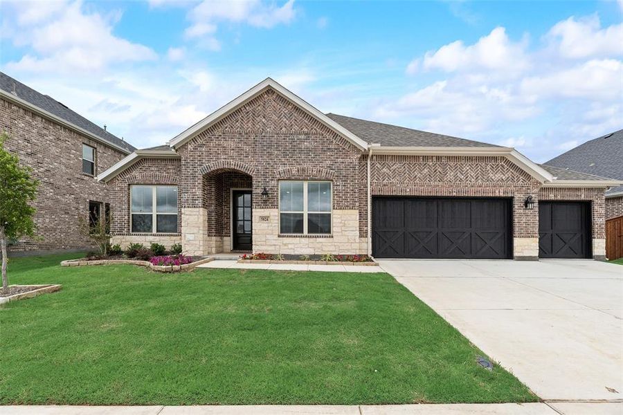 Front exterior of a new home in Sutton Fields, Celina, TX, highlighting curb appeal (Image 19).