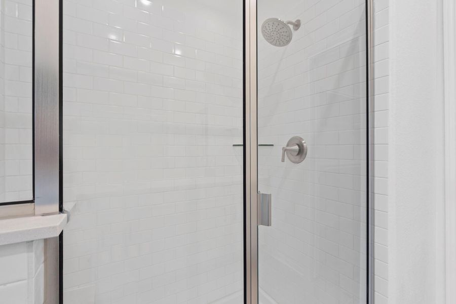 This additional view of your primary bathroom features tile flooring, fresh paint, a large walk-in shower, and a large walk-in closet. This additional view of your primary bathroom features tile flooring, fresh paint, a large walk-in shower, and a large walk-in closet.