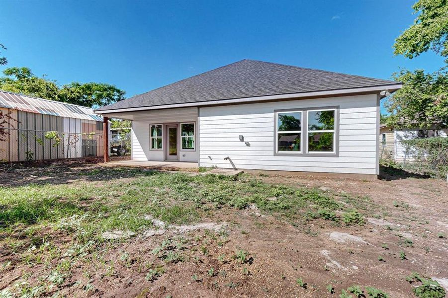 Back of house with a patio area