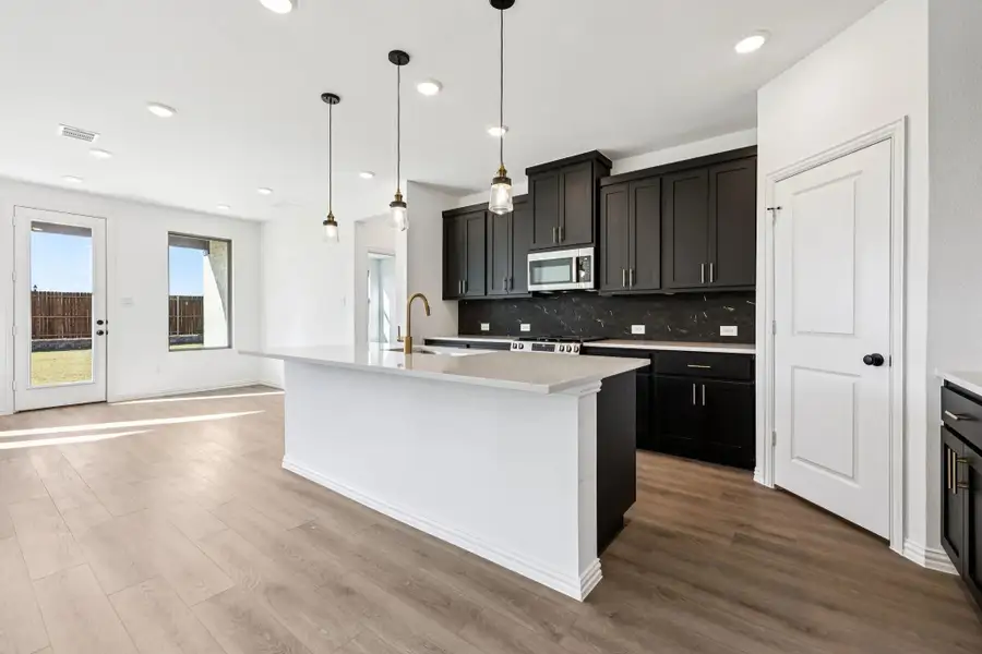 Open Kitchen-Dining Room Representative Photo featuring the Noir Collection Open Kitchen-Dining Room Representative Photo featuring the Noir Collection
