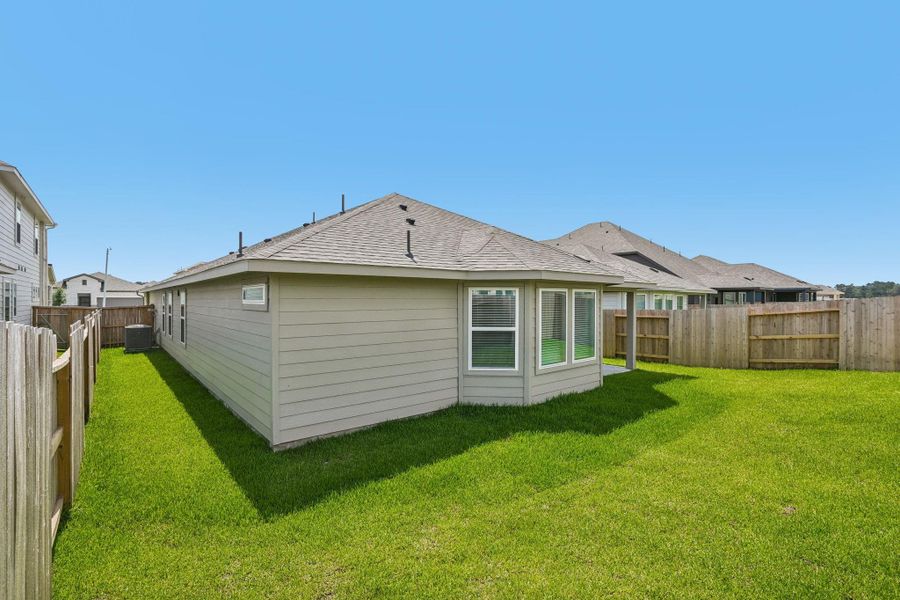 Exterior details and patio area of a home in Riviera Pines - Premier Series, Huffman (Image 3).