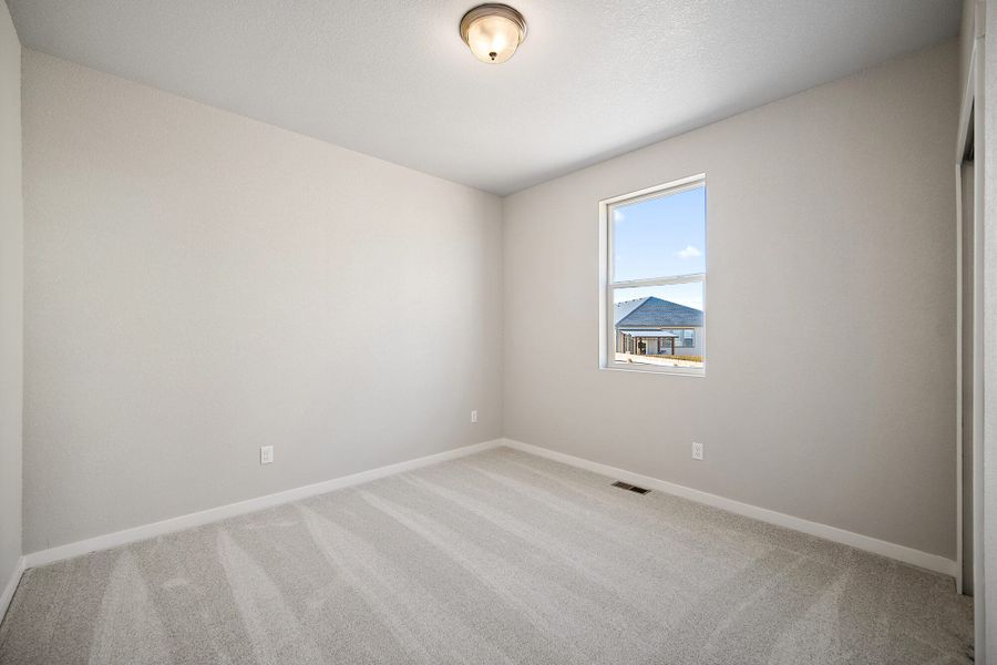 Spacious, unfurnished interior of a new home in The Glen, Colorado Springs (Image 14).