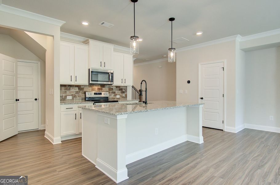 Furnished interior view inside a new home in The Towns at Auburn Station West, Auburn (Image 5).
