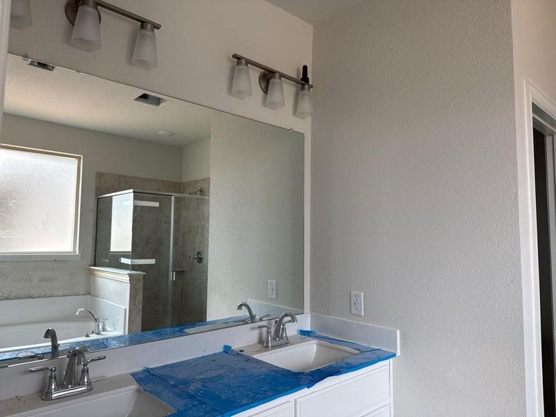 Double vanity featuring undermount sinks and chrome faucets