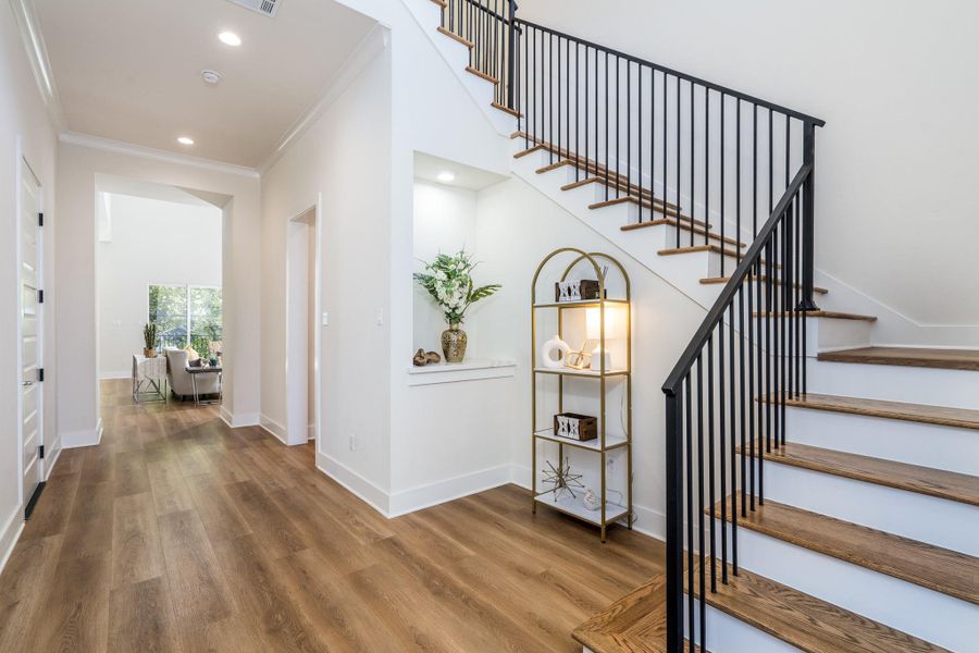 High-end luxury vinyl plank flooring flows seamlessly through the home, creating a cohesive, modern aesthetic. High-end luxury vinyl plank flooring flows seamlessly through the home, creating a cohesive, modern aesthetic.