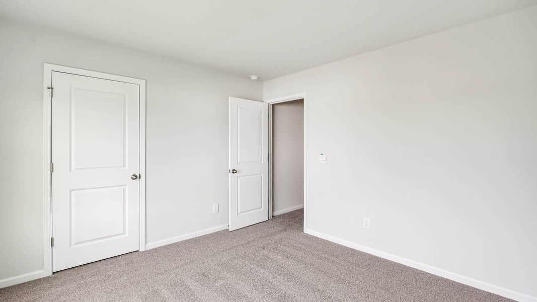 Spacious, unfurnished interior of a new home in Sidbury Station, Castle Hayne (Image 39).