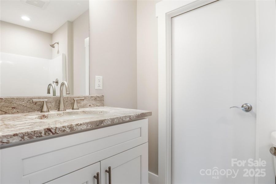 3rd bathroom located upstairs; perfect for guests.