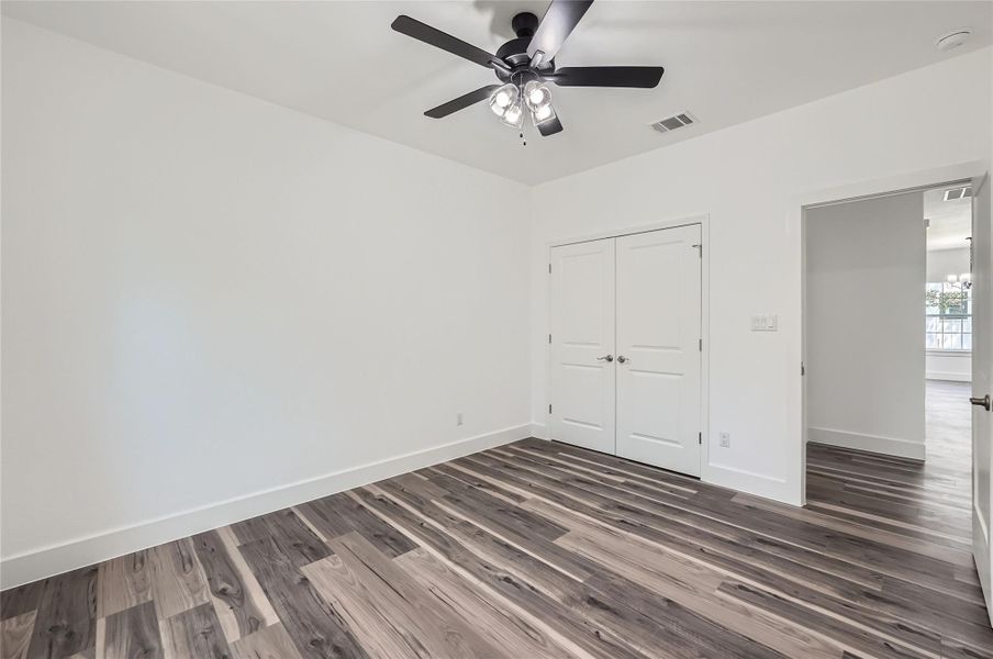 Bedroom #3 with a closet, and a ceiling fan