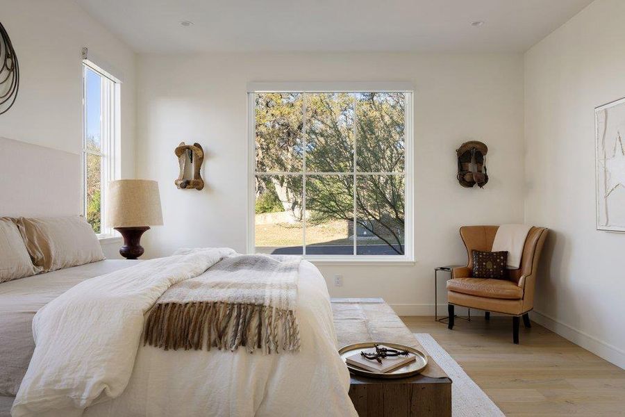 This room features light-colored walls and light wood flooring, creating a bright and airy atmosphere